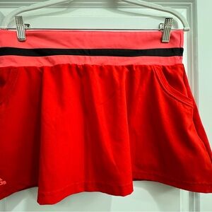 Red, black and pink adidas tennis skirt with pockets